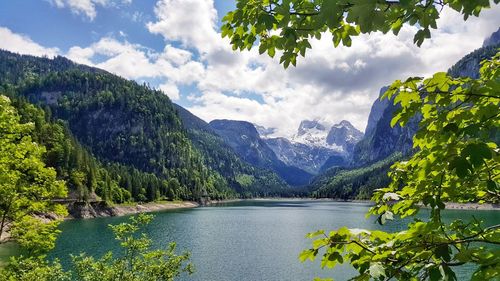 Scenic view of lake and mountains against sky