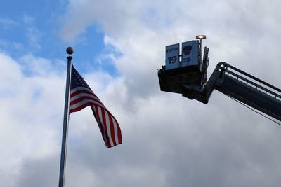 Low angle view of flag against sky