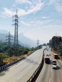 Cars on road against sky