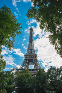 Low angle view of tower against cloudy sky