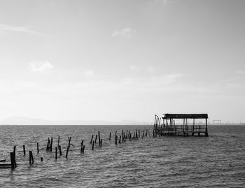 Pier on sea against sky