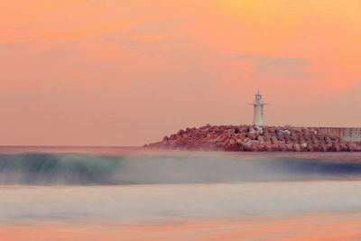 Scenic view of sea against sky at sunset