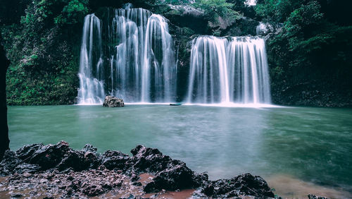 View of waterfall in forest