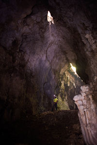 Go down using the rope in the vertical cave