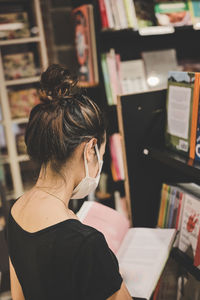 Series photo of young women choosing book in a bookshop , learning and education concept