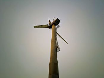 Low angle view of wind turbine against sky