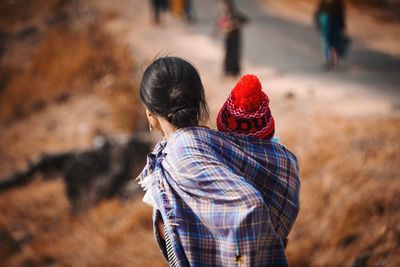 Rear view of woman standing outdoors