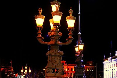 Low angle view of illuminated lights at night