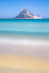 Scenic view of sea against blue sky