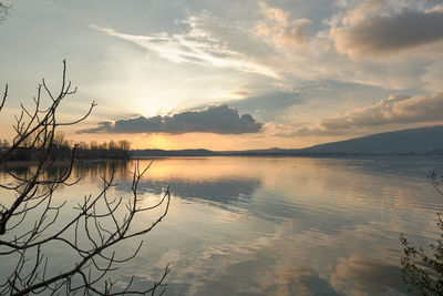 Scenic view of lake against sky during sunset