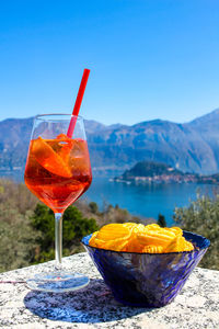 Close-up of drink against blue sky