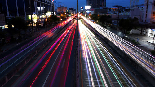 High angle view of light trails on road at night