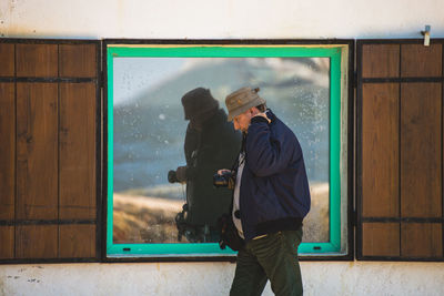 Man photographing at camera