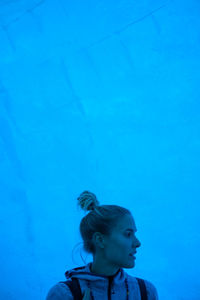 Young woman in ice cave