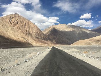 Scenic view of mountain road against sky