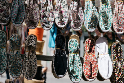 Close-up of footwear hanging on display at store