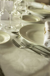 High angle view of drinking glasses on table