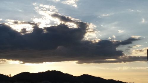 Scenic view of landscape against cloudy sky