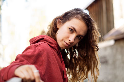 Portrait of young woman with brown hair