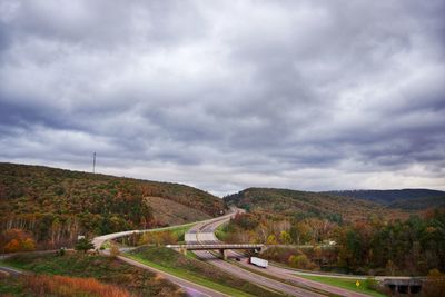 Scenic view of bridge over road against sky