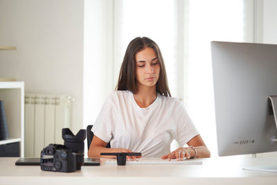 Young woman working at desk