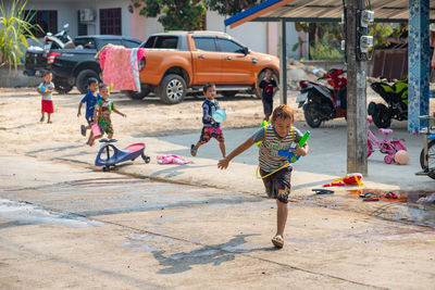 Children playing with umbrella