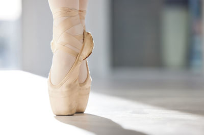 Low section of woman standing on floor