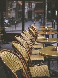 Wicker chairs and tables at outdoor restaurant