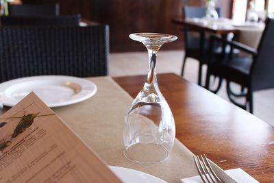 Close-up of wineglass on dining table at restaurant