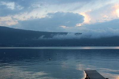 Scenic view of lake against sky during sunset