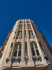 Low angle view of building against blue sky