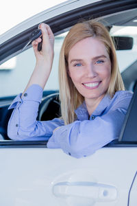 Close-up portrait of woman sitting car
