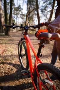 Man with bicycle on tree