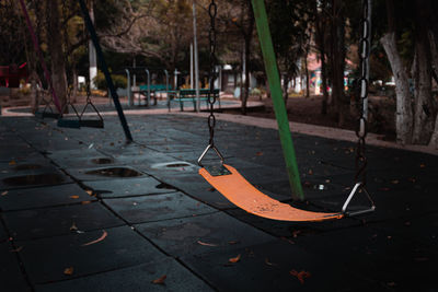 Empty swing in abandoned park