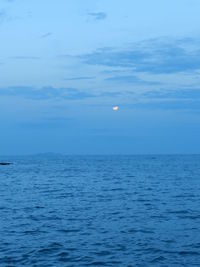 Scenic view of sea against blue sky