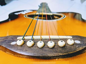 Close-up of guitar on table