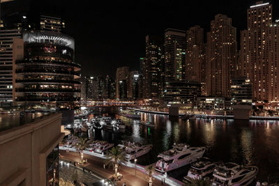 High angle view of illuminated buildings in city at night