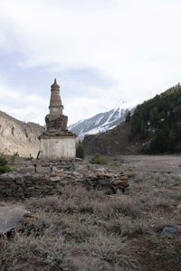 View of temple on mountain against sky