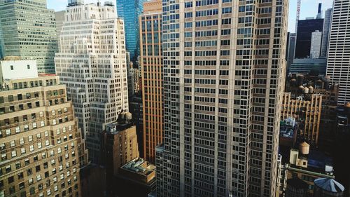 Low angle view of modern buildings in city of manhattan