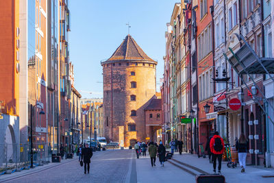 People walking on street in city