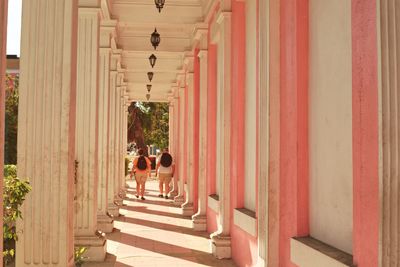 Rear view of people walking on steps