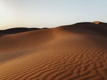 Scenic view of desert against clear sky