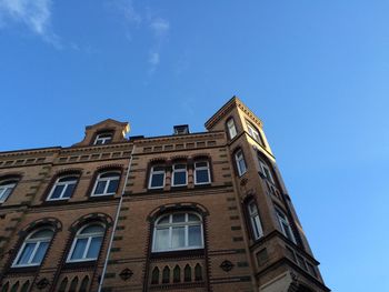 Low angle view of building against blue sky