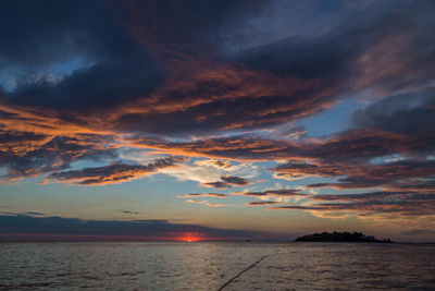 Scenic view of sea against sky at sunset