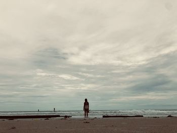 Woman standing on beach