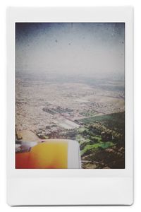 Scenic view of landscape seen through airplane window