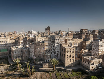 High angle view of buildings against clear sky