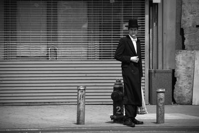 Full length of woman standing in city