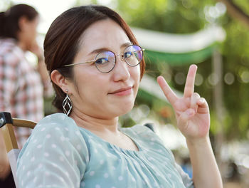 Portrait close-up lifestyle smart caucasian woman wearing glasses sitting smiling happy face 