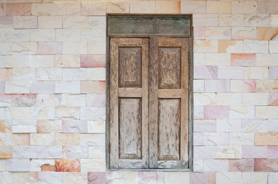 Full frame shot of closed door on wall of building